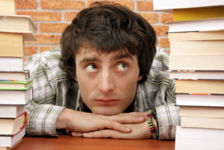 Worried student by number of books to read man books