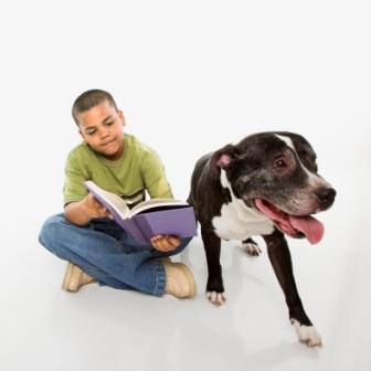 Boy Reading To Dog