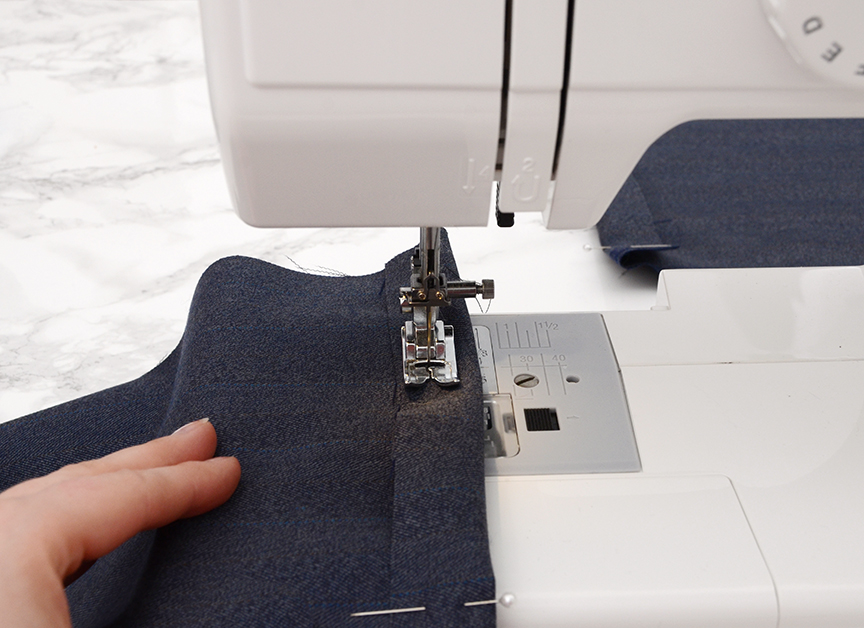 Sewing Machine Person sewing fabric on sewing machine